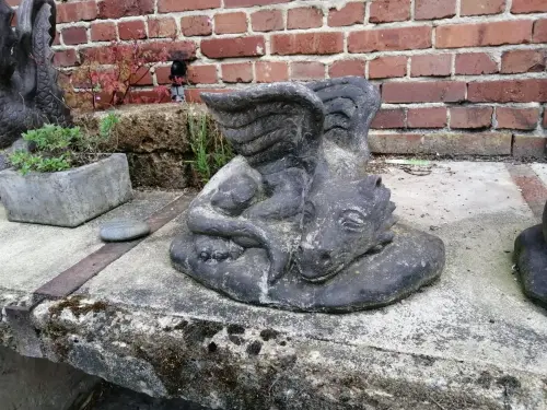 Product image of the product “Lying Dragon on stone, ca. 50 cm L antique finish, pressed stone ”